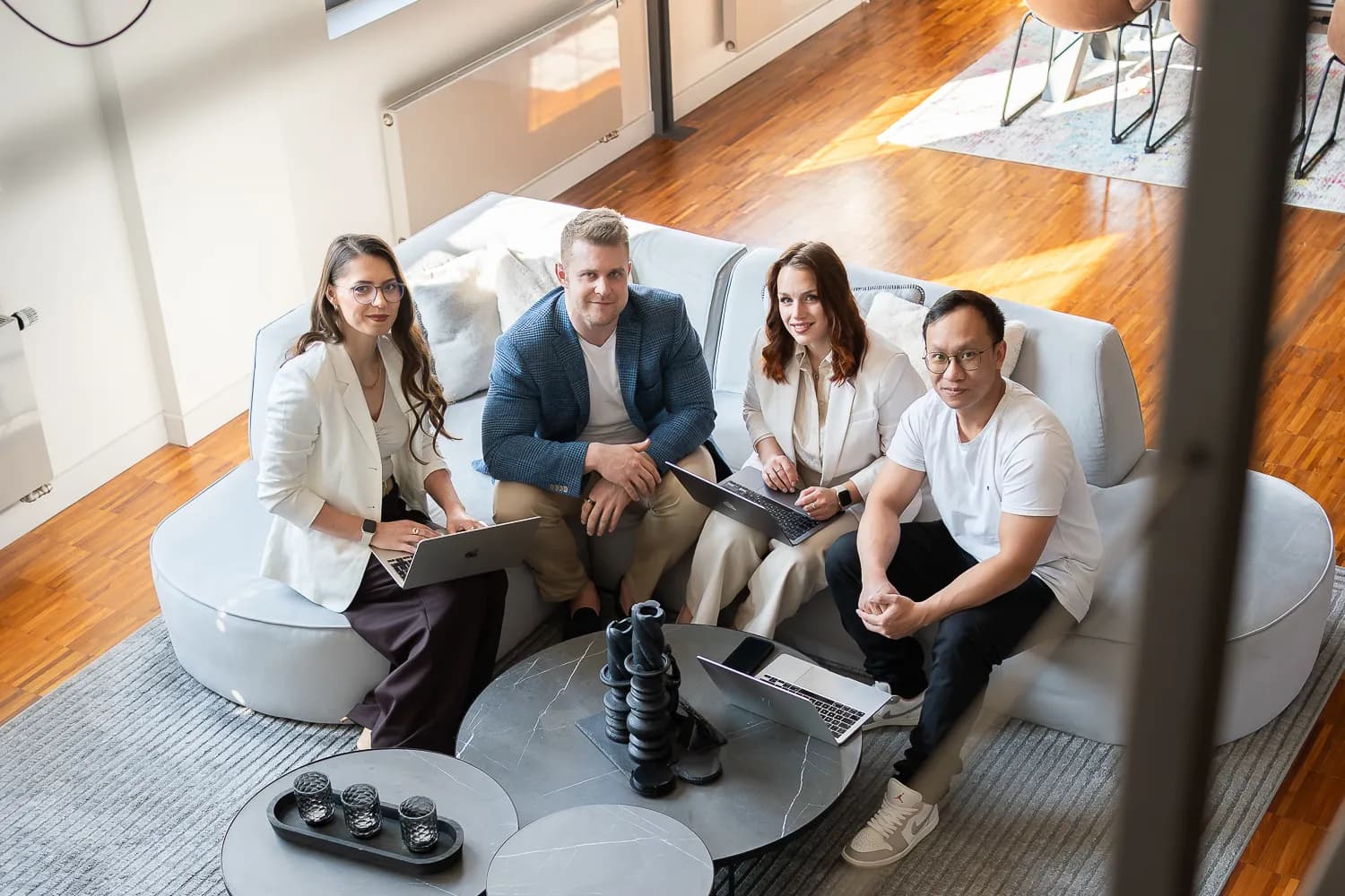 The ThriveAds team collaborating around a laptop